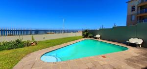 a swimming pool in the backyard of a house at La Mer 12 - 9 Sleeper - Stylish & Sophisticated! in Margate