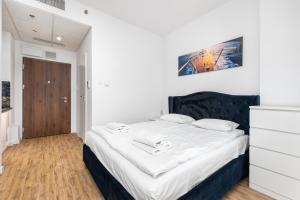 Posteľ alebo postele v izbe v ubytovaní Kasprzaka 29 B-C by Homeprime