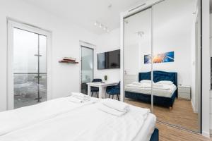 Posteľ alebo postele v izbe v ubytovaní Kasprzaka 29 B-C by Homeprime