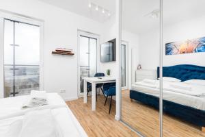 Posteľ alebo postele v izbe v ubytovaní Kasprzaka 29 B-C by Homeprime