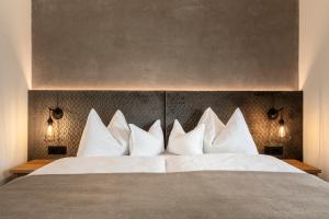 Postel nebo postele na pokoji v ubytování Hotel Niblea Dolomites