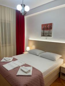 Postel nebo postele na pokoji v ubytování Apartmani Dragica