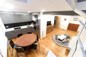 an overhead view of a kitchen and dining room with a table at Arriaga 1 in Marquina
