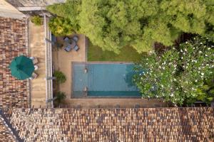 an overhead view of a swimming pool behind a fence at 41 Lighthouse Street in Galle