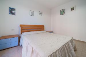 A bed or beds in a room at Appartamenti Bilo Sofi