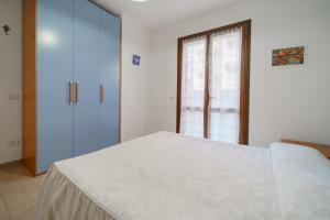 A bed or beds in a room at Appartamenti Bilo Sofi