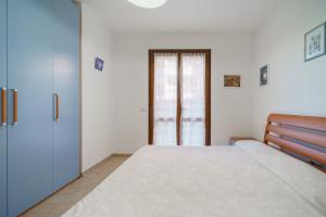 A bed or beds in a room at Appartamenti Bilo Sofi