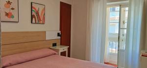 Postel nebo postele na pokoji v ubytování Hostal Bahía