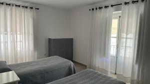 Postel nebo postele na pokoji v ubytování Hostal Bahía