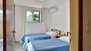 Ένα ή περισσότερα κρεβάτια σε δωμάτιο στο Blue Bay Apartment +17 φωτογραφίες