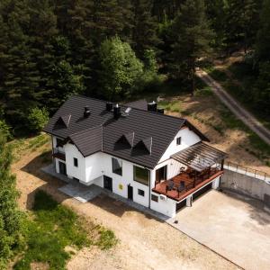 an aerial view of a house with a roof at Leśna Rezydencja in Łabowa