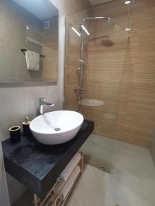 a bathroom with a sink and a shower at Villa Lemon Garden - Apartment in Dubrovnik in Mlini