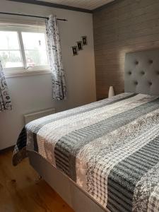A bed or beds in a room at B & B Flattinge Fritidshus