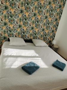 Postel nebo postele na pokoji v ubytování Chez Arnauld