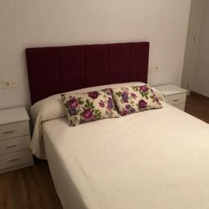 Łóżko lub łóżka w pokoju w obiekcie Carla24, AVENIDA PRINCIPAL