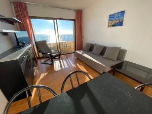a living room with a couch and a table at Mar Play in Sant Antoni de Calonge