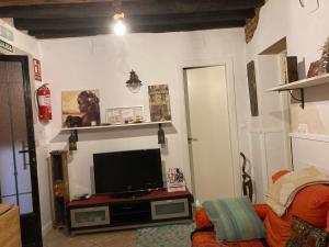 a living room with a flat screen tv on a wall at La Casina Apartamento Turistico centro Plasencia AT-CC-0650 in Plasencia