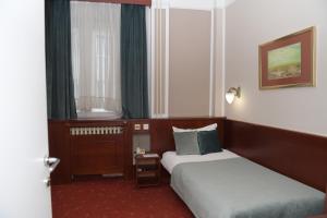 Postel nebo postele na pokoji v ubytování Palace Hotel