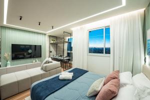 Ένα ή περισσότερα κρεβάτια σε δωμάτιο στο Studio Maravilhoso em Itapoã