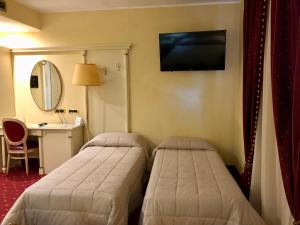 Postel nebo postele na pokoji v ubytování Grand Hotel Osman Ristorante il Danubio