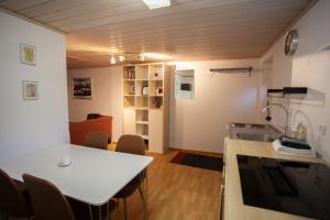 a kitchen with a table and chairs in a room at 2BR Apt / Central / Tórshavn in Tórshavn