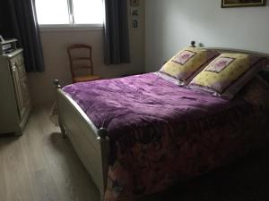 Posteľ alebo postele v izbe v ubytovaní Au Vieux Bourg