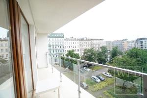 a balcony with a view of a parking lot at Modern Apartment-City Center-New Building-Garage in Wrocław