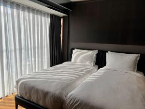 Voodi või voodid majutusasutuse Hotel MANAMI toas