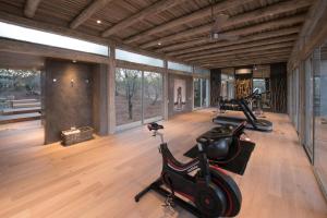 a gym with two exercise bikes in a room at Kapama Karula in Kapama Private Game Reserve