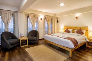Hotel Timila客房内的一张或多张床位