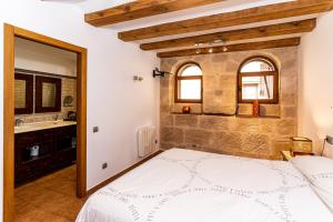 Postel nebo postele na pokoji v ubytování Apartamento Duplex Puente de Piedra, en un enclave único y exclusivo