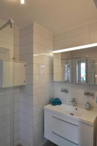 Koupelna v ubytování Appartementhaus Flori + 33 fotografií