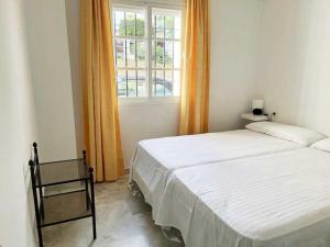 Säng eller sängar i ett rum på Apartamento en Estepona Marbella