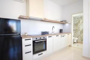 Kuchyň nebo kuchyňský kout v ubytování Asteria Apartments