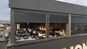 a view of a restaurant through the window of a building at Leslion Luxury Hotel in Antalya