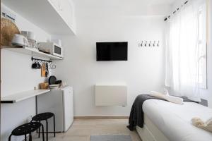TV a/nebo společenská místnost v ubytování Estudio con encanto en Fuencarral