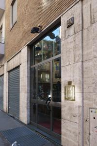 an entrance to a building with a sign on it at PORTA VENEZIA-TRILOCALE-LUXURY con Wifi-Neflix in Milan