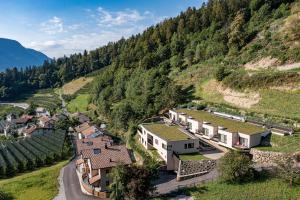 an aerial view of a village in a mountain at Castanea Appartements in Caines