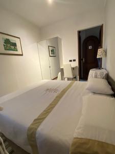 A bed or beds in a room at L'angolo di Chiavari