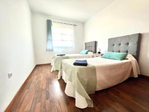 Posteľ alebo postele v izbe v ubytovaní FTV Holidays Homes