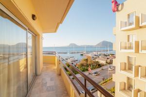 a balcony with a view of the water at Sea Front Luxury Apartment in Patra