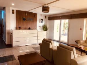 a living room with a couch and a table at Nisa Wellness Retreat in Abuja