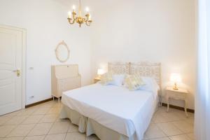 Postel nebo postele na pokoji v ubytování Hotel La Pineta Al Mare