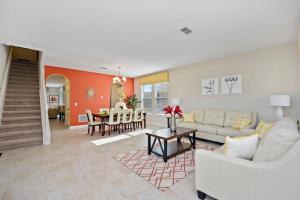 a living room with a couch and a table at Serene Bliss at White Rose Villas in Davenport