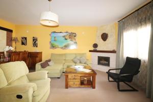 a living room with a couch and a fireplace at Casa Nayroa by Spainsunrentals 1019 in Nerja