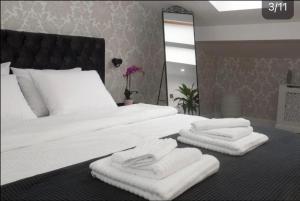 Krevet ili kreveti u jedinici u objektu Benvenuti Apartments