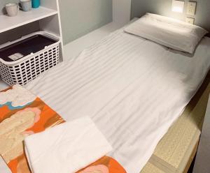 Posteľ alebo postele v izbe v ubytovaní Jing House akihabara Ryokan - Vacation STAY 30899v