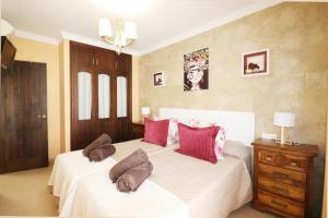 a bedroom with two beds with pillows on them at Casa Nayroa by Spainsunrentals 1019 in Nerja