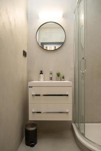 a bathroom with a sink and a mirror at VagusBouda/ &Fogo in Loučná nad Desnou