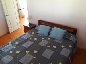Uma cama ou camas num quarto em Rosa Herminia